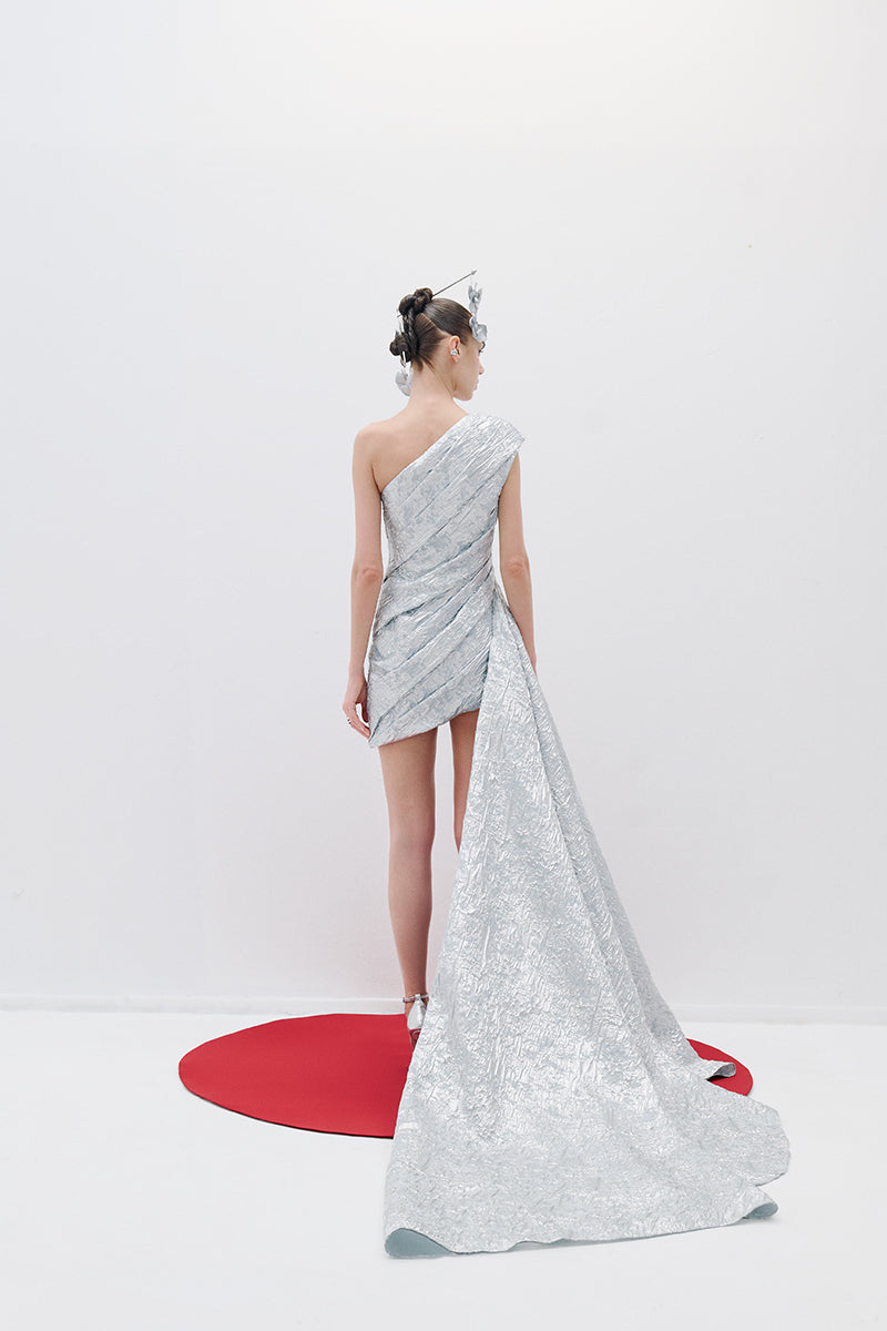 ONE-SHOULDER DRAPED MINI DRESS WITH TAIL IN SILVER - CULT MIA