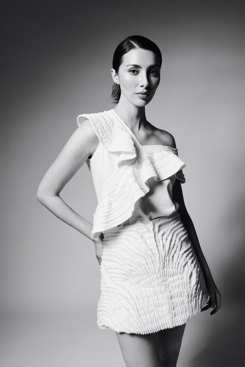 ASYMMETRIC FLAIR DENIM TOP IN IVORY - CULT MIA