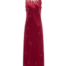 Bias-cut burgundy slip dress by Not Just Pajama with rhinestone embellishments and feather accents, featuring a maxi length and elegant design.