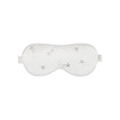 White and light purple rhinestone eye mask from Not Just Pajama, a stylish loungewear accessory for relaxing.
