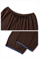 Unisex brown pants from Not Just Pajama with a relaxed fit, featuring a comfortable waistband and casual style.