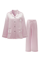 Pink plush trim long pajama set by Not Just Pajama, featuring cozy fabric and relaxed fit for comfortable sleepwear.