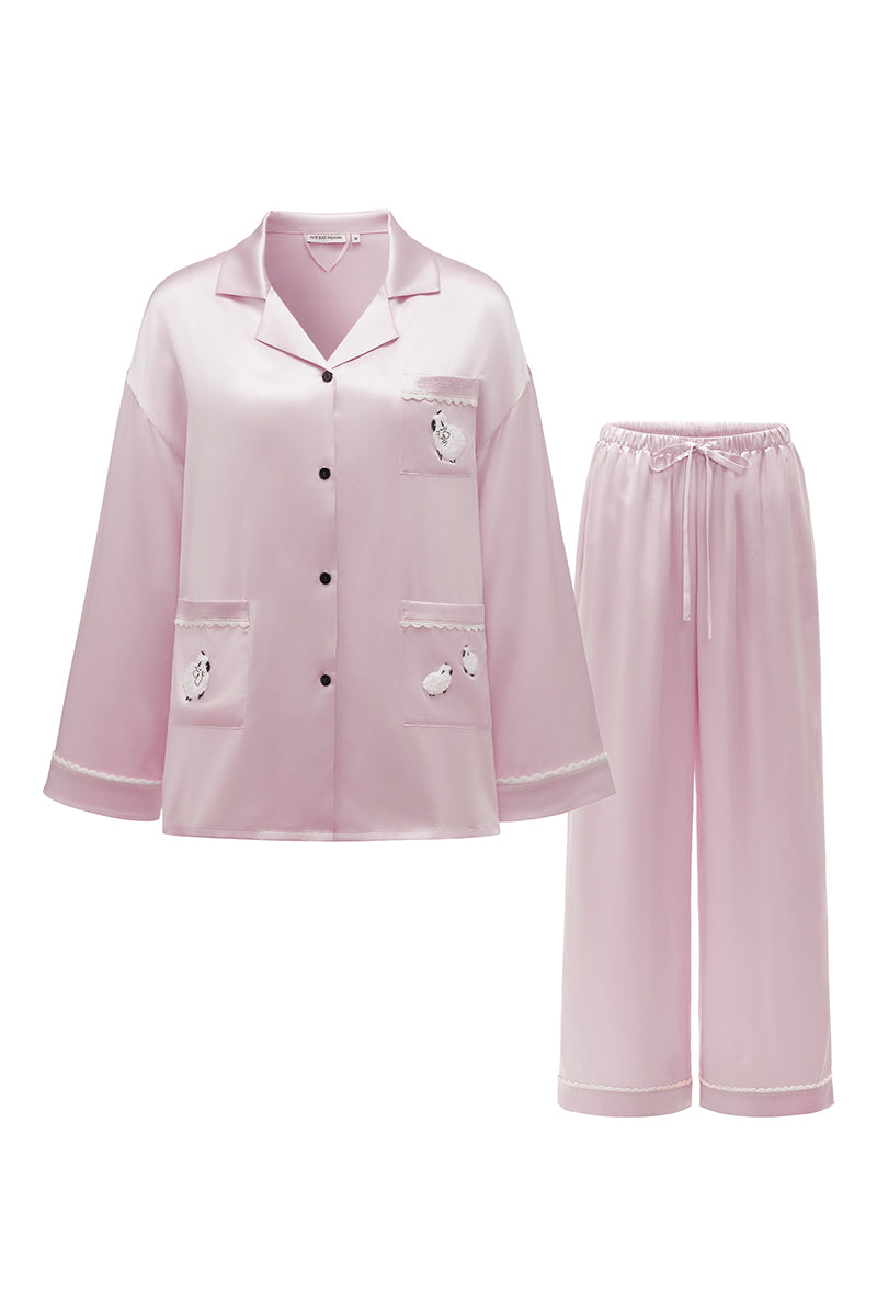 Pink plush trim long pajama set by Not Just Pajama, featuring cozy fabric and relaxed fit for comfortable sleepwear.