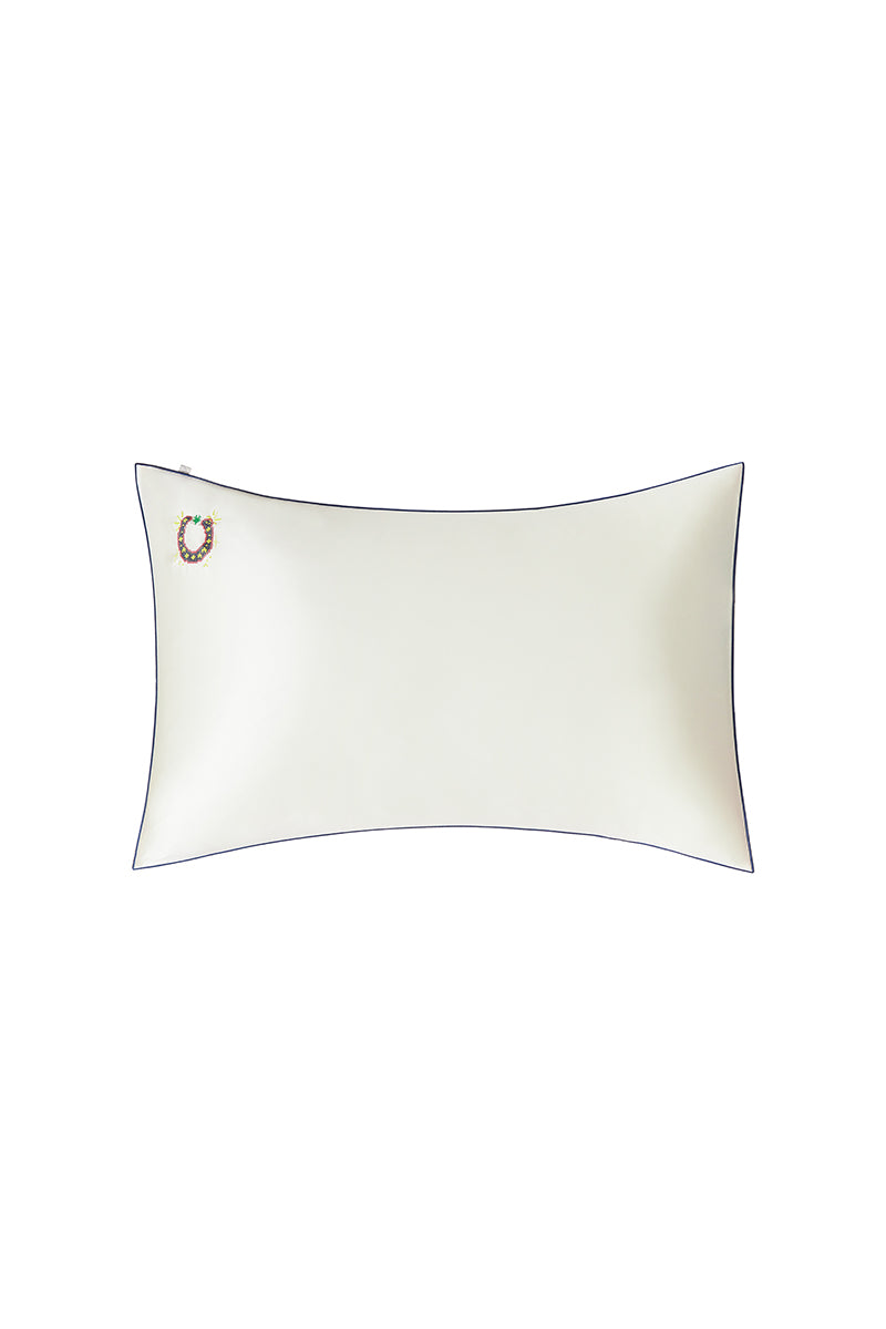 Pearl white loungewear pillowcase from Not Just Pajama, soft fabric with smooth, elegant texture for comfortable sleep or relaxation.