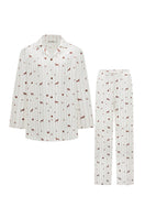 Unisex brown printed twill pajamas set featuring long sleeves and matching pants for comfortable sleepwear.