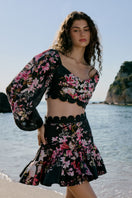 AISA Flora Top, stylish women's blouse with floral pattern, lightweight fabric, and short sleeves, displayed on a hanger.