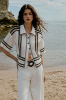 AISA Olivia shirt in light fabric with a classic collar, button-front design, and long sleeves, displayed on a hanger.