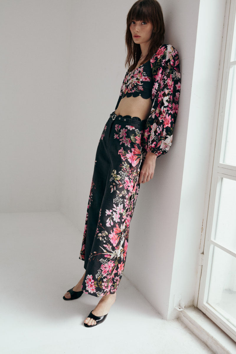 AISA Flora Pants in neutral color, featuring a relaxed fit and stylish design, shown on a model against a plain background.