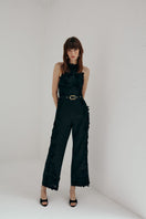 AISA Aurelia jumpsuit featuring a stylish design with a fitted waist and wide-leg pants, displayed on a hanger against a neutral background.