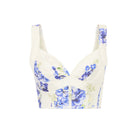 AISA FERYAL top in soft fabric with a stylish neckline, displayed on a hanger against a neutral background.