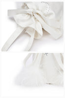 White top handle handbag with rhinestones and feather accents by Not Just Pajama, featuring a stylish and elegant design.