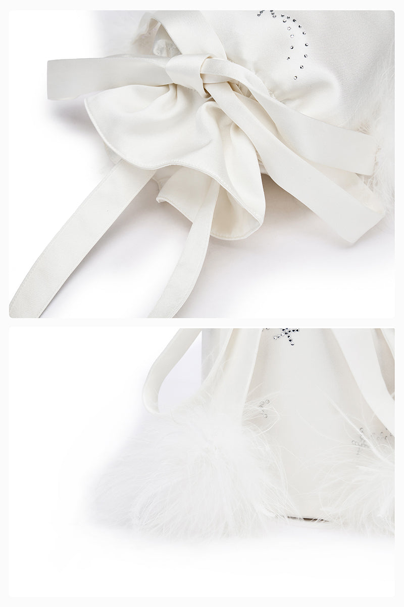 White top handle handbag with rhinestones and feather accents by Not Just Pajama, featuring a stylish and elegant design.