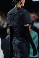 Black bustier gown with matching mini cape by I.H.F, featuring fitted bodice and elegant cape detail.