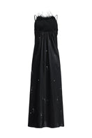 Black bias-cut slip dress with rhinestones and feather embellishments, featuring a maxi length and elegant design.