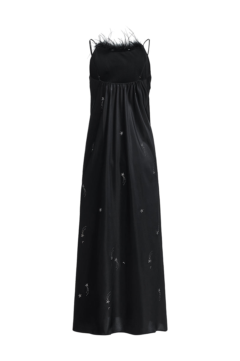 Black bias-cut slip dress with rhinestones and feather embellishments, featuring a maxi length and elegant design.