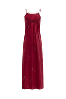 Bias-cut burgundy slip dress with rhinestones and feather embellishments, featuring a maxi length and elegant design.