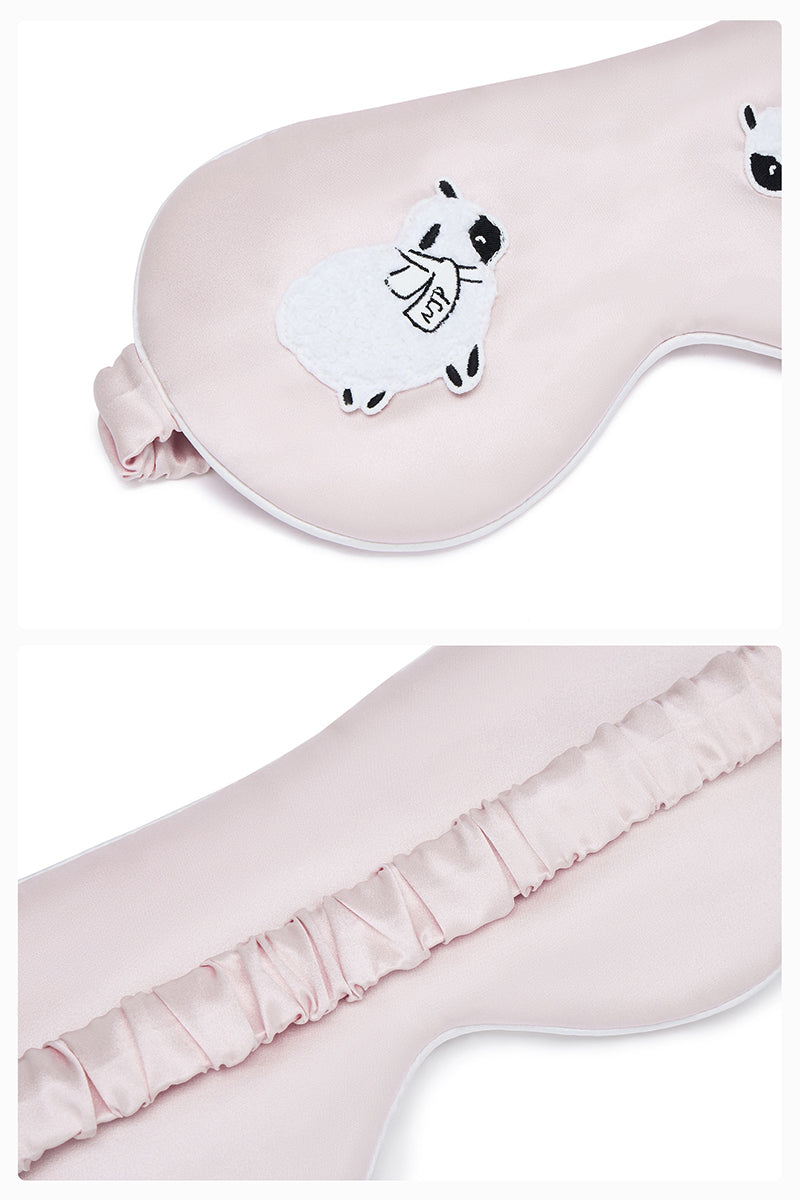Pink eye mask from Not Just Pajama loungewear collection, soft fabric for relaxing rest and sleep.