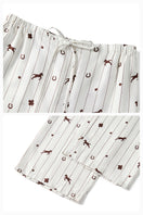 Unisex brown printed twill pajama long set from Not Just Pajama, featuring comfortable button-up top and matching pants.