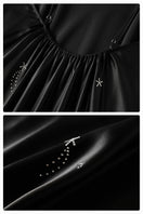 Black bias-cut slip dress with feather accents and rhinestones, featuring a maxi dress style from Not Just Pajama.
