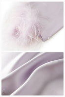 Light purple feather and rhinestone short robe from Not Just Pajama, featuring a stylish, elegant design with feather details.
