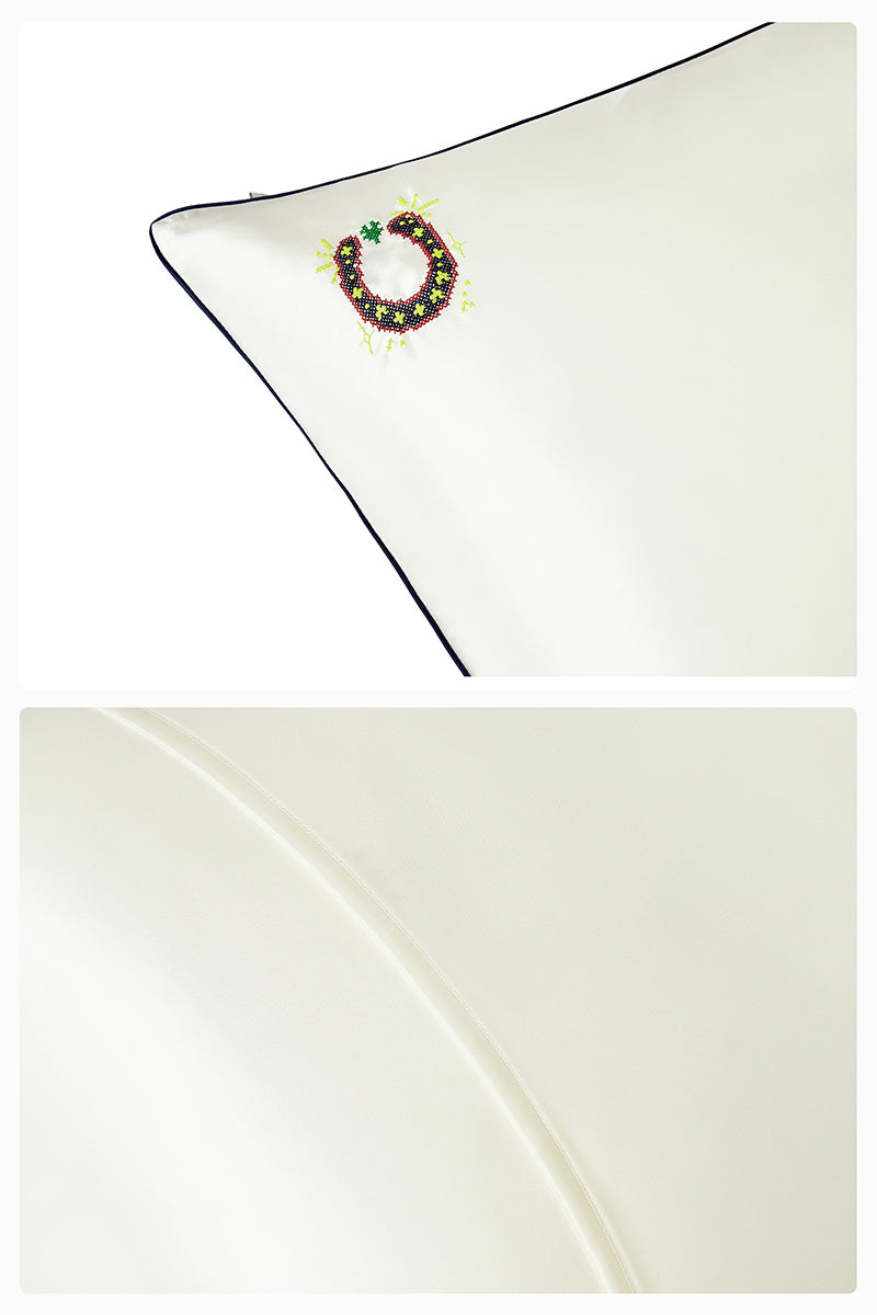 Pearl white loungewear pillowcase from Not Just Pajama, soft fabric with smooth texture, designed for comfortable sleep and relaxation.