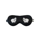 Black Not Just Pajama eye mask for loungewear, made of soft fabric, designed to block light and provide comfort.