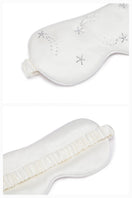 White and light purple rhinestone eye mask from Not Just Pajama, perfect for luxurious loungewear and relaxing sleep.
