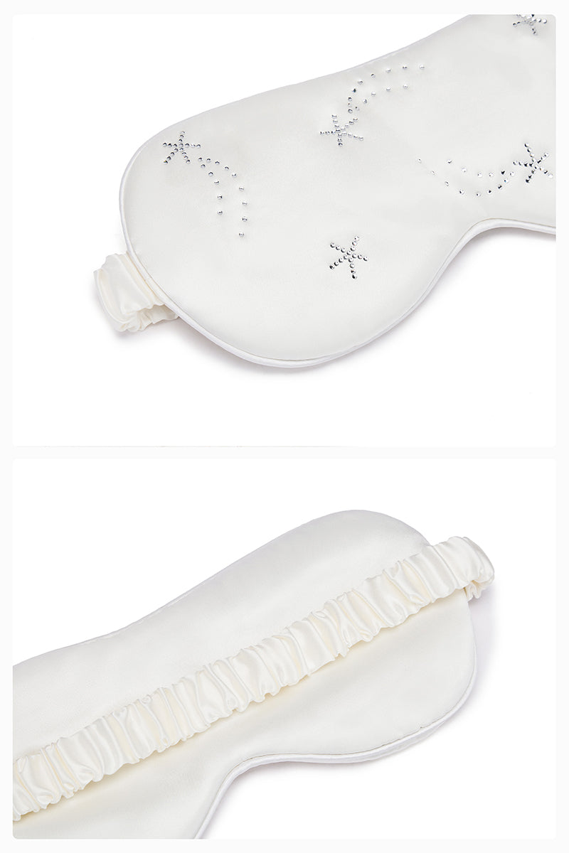 White and light purple rhinestone eye mask from Not Just Pajama, perfect for luxurious loungewear and relaxing sleep.