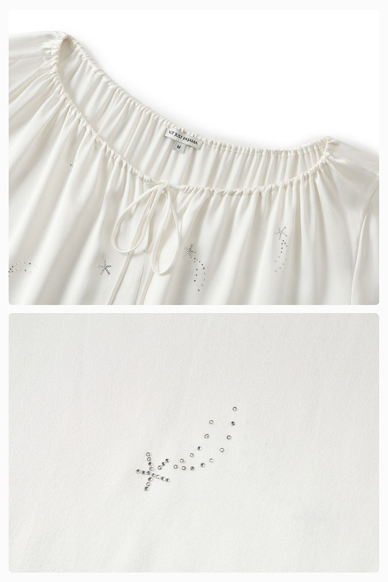 White feather robe with rhinestones, luxurious gown by Not Just Pajama featuring feather details and elegant design.