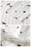 Unisex brown printed twill pajamas set featuring a long-sleeve top and matching pants, comfortable and stylish for sleep or lounging.