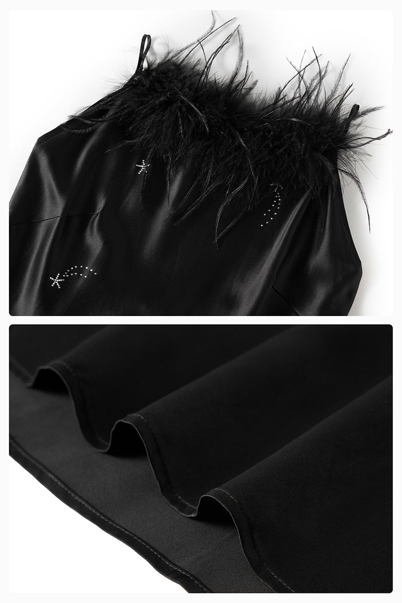 Black bias-cut slip dress with rhinestones and feather embellishments, featuring a flowing maxi dress style by Not Just Pajama.