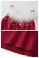 Bias-cut burgundy slip dress with rhinestones and feather embellishments, featuring a maxi length and elegant design.