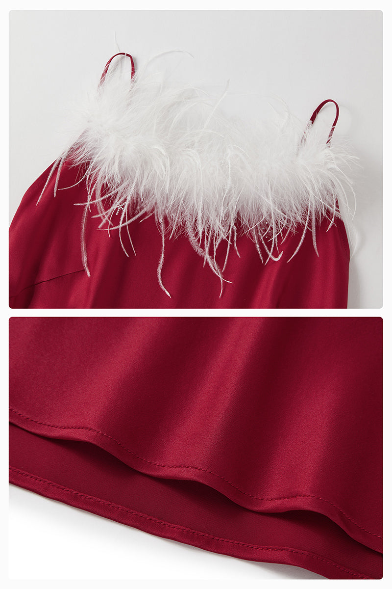 Bias-cut burgundy slip dress with rhinestones and feather embellishments, featuring a maxi length and elegant design.