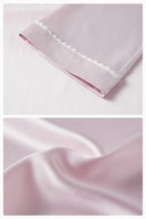 Pink plush trim long pajamas set by Not Just Pajama, featuring soft fabric and cozy fit for comfortable sleepwear.