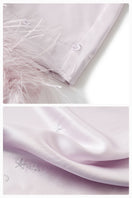 Light purple feather long-sleeve pajama set with rhinestones from Not Just Pajama, featuring soft feathers and cozy design.