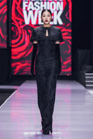 Black bustier gown with a mini cape from I.H.F, featuring a fitted bodice and elegant cape overlay for formal occasions.