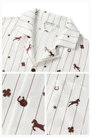 Unisex brown print twill pajama long set from Not Just Pajama, featuring a comfortable button-up top and matching pants.