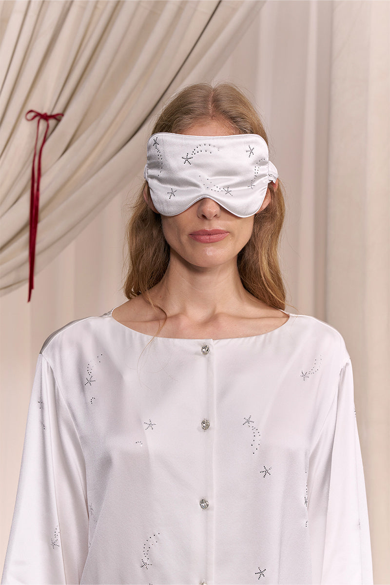 White and light purple rhinestone eye mask in soft loungewear style, featuring sparkling embellishments for comfortable relaxation.