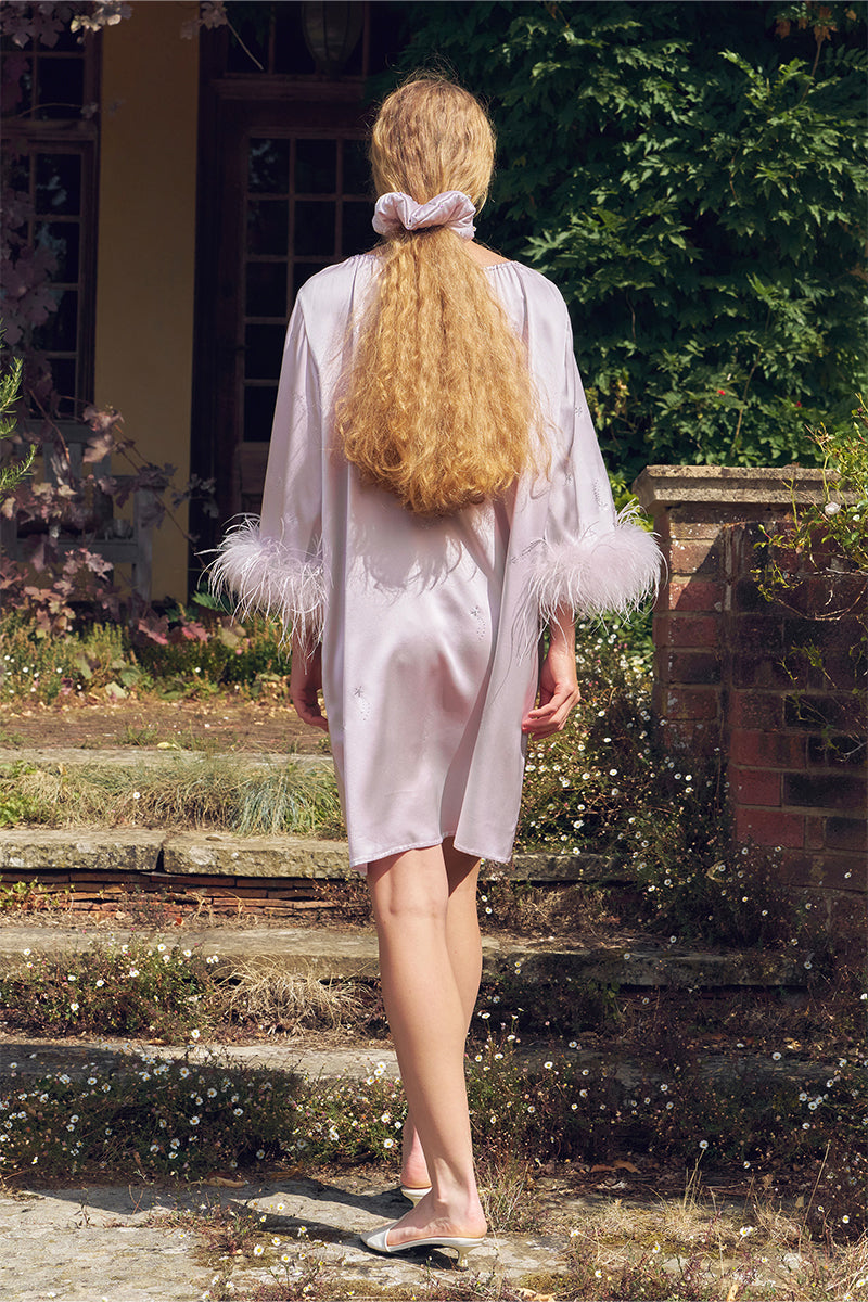 Light purple feather and rhinestone short robe from Not Just Pajama, featuring a delicate midi dress design with feather details.