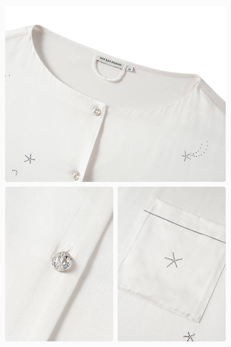 White feather long-sleeve pajama set with rhinestones from Not Just Pajama featuring feather details and comfortable fabric.