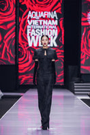 Black bustier gown with a mini cape by I.H.F, featuring fitted bodice and stylish cape detail, perfect for elegant occasions.