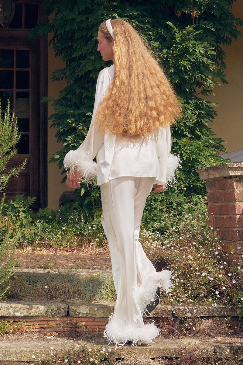 White feather long-sleeve pajama set with rhinestone accents by Not Just Pajama, featuring soft feather details and comfortable fit.
