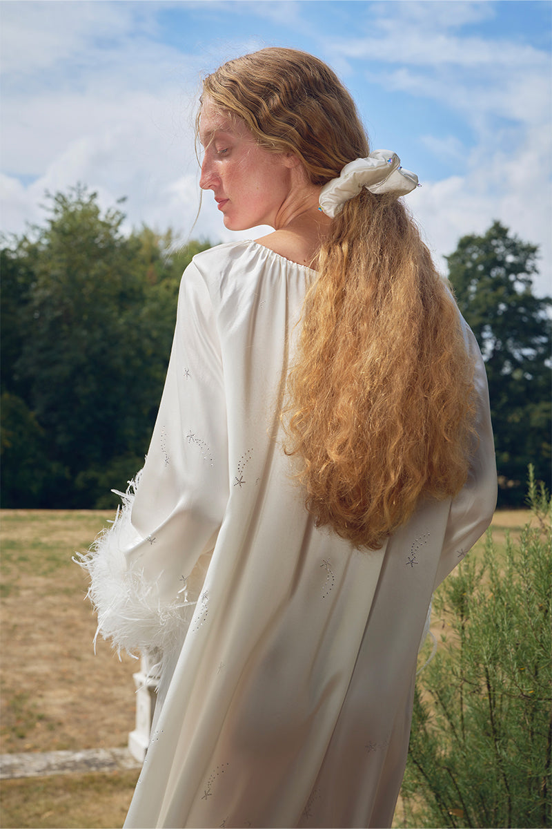 White feather robe with rhinestones, luxurious gown by Not Just Pajama featuring elegant feather details.