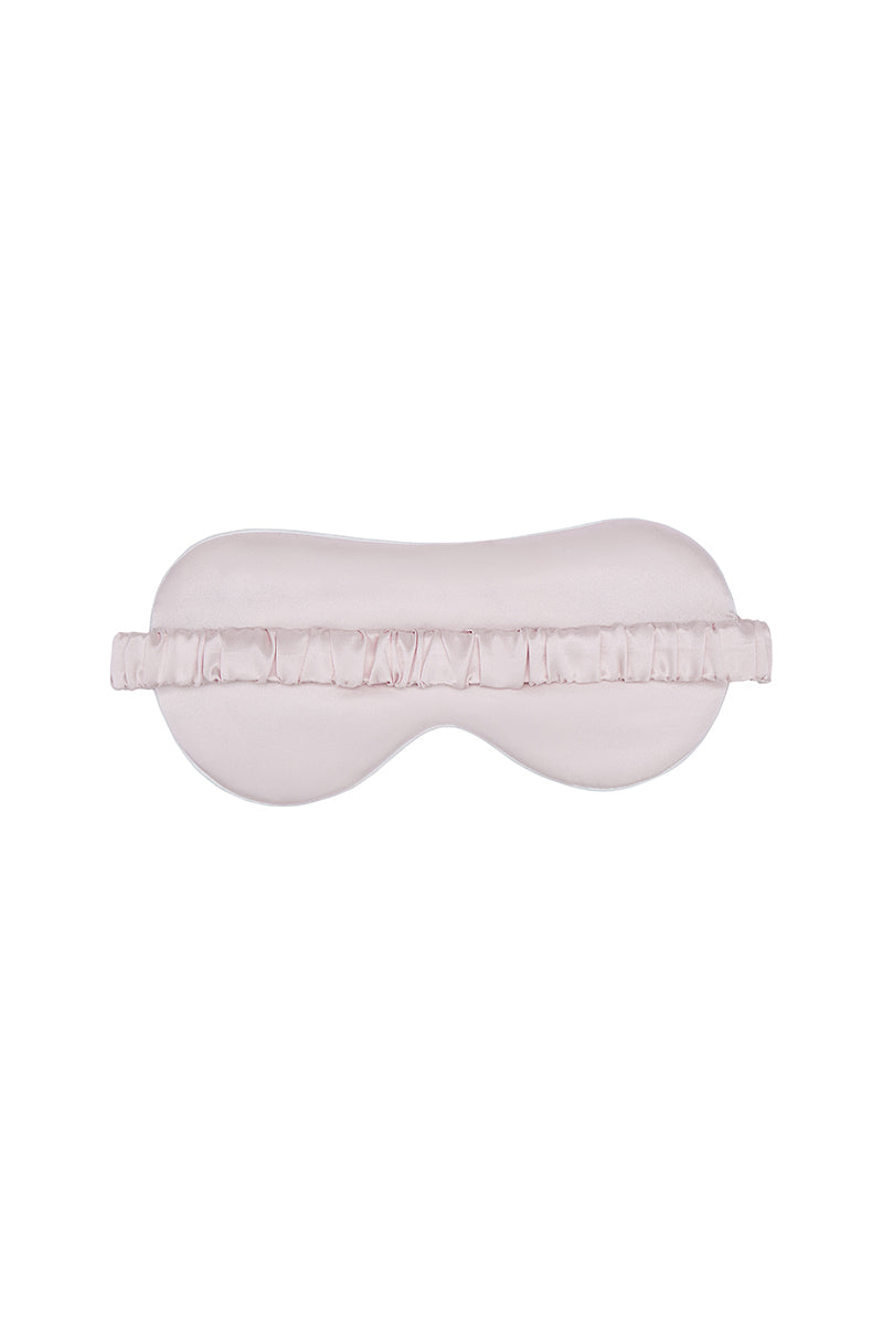 Pink Not Just Pajama eye mask, soft loungewear accessory with comfortable fabric for relaxing and sleeping.