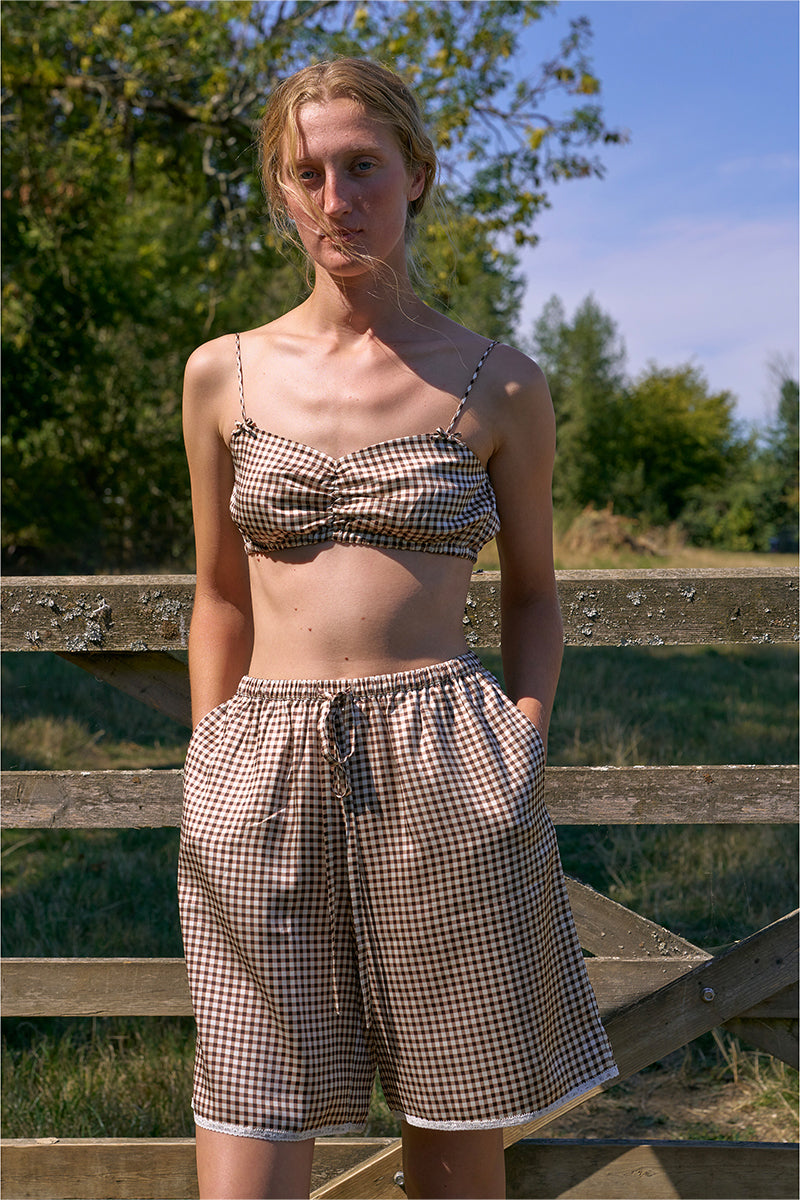 Brown plaid printed bandeau top and matching shorts pajamas set by Not Just Pajama, featuring a casual, comfortable sleepwear design.