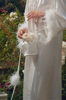 White rhinestone and feather top handle handbag with elegant details, designed by Not Just Pajama.