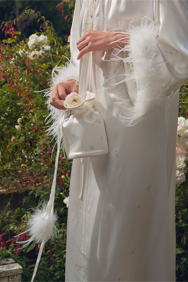 White rhinestone and feather top handle handbag with elegant details, designed by Not Just Pajama.