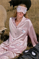 Pink plush trim long pajama set from Not Just Pajama featuring soft fabric and cozy design.
