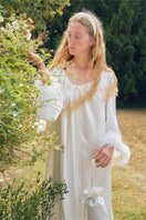White feather gown with rhinestone accents by Not Just Pajama, featuring luxurious feather details and elegant robe design.