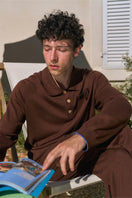 Unisex brown long sleeve knitwear shirt from Not Just Pajama, featuring a cozy, fitted design and ribbed cuffs.